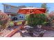 The backyard patio features ample seating, perfect for outdoor dining and entertaining at 10057 Cedaridge Way, Highlands Ranch, CO 80129