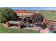 Relaxing backyard setting with comfortable seating and a picturesque view of open fields at 10057 Cedaridge Way, Highlands Ranch, CO 80129
