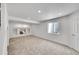 Finished basement offers neutral carpet, recessed lighting, a built-in niche, and a window at 10057 Cedaridge Way, Highlands Ranch, CO 80129