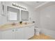 Bathroom featuring double sinks, a bathtub, and neutral colored flooring at 10057 Cedaridge Way, Highlands Ranch, CO 80129