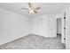 Bright bedroom offers ample closet space, neutral walls and gray carpet at 10057 Cedaridge Way, Highlands Ranch, CO 80129