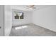 Bright bedroom with a large window allowing natural light and neutral gray carpet at 10057 Cedaridge Way, Highlands Ranch, CO 80129