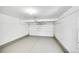 Spacious two-car garage with concrete floors and pegboard paneling for storage at 10057 Cedaridge Way, Highlands Ranch, CO 80129