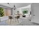 Bright, modern living room features neutral tones and a scenic window view at 10057 Cedaridge Way, Highlands Ranch, CO 80129