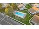 Aerial view of community pool surrounded by residential buildings at 8767 Chase Dr # 195, Arvada, CO 80003
