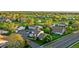 Expansive aerial view showcasing the neighborhood, with lush greenery, ponds, and well-spaced homes at 8767 Chase Dr # 195, Arvada, CO 80003
