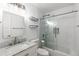 Bright and clean bathroom with a marble countertop vanity and glass enclosed shower at 8767 Chase Dr # 195, Arvada, CO 80003