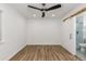 Bedroom with hardwood floors and modern ceiling fan at 8767 Chase Dr # 195, Arvada, CO 80003