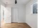 Bedroom featuring a ceiling fan and double door closet with paneled doors at 8767 Chase Dr # 195, Arvada, CO 80003