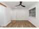 Spacious bedroom featuring hardwood floors and modern ceiling fan at 8767 Chase Dr # 195, Arvada, CO 80003