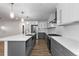Modern kitchen with a large island, stainless steel appliances, and stylish pendant lighting at 8767 Chase Dr # 195, Arvada, CO 80003