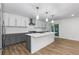 Renovated kitchen featuring gray cabinets, white countertops, and a stainless steel hood at 8767 Chase Dr # 195, Arvada, CO 80003