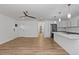 Spacious living room featuring wood floors, modern fixtures, and an open layout at 8767 Chase Dr # 195, Arvada, CO 80003