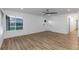 Inviting living room with wood floors, large window, and direct access to the front door at 8767 Chase Dr # 195, Arvada, CO 80003