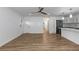 Light-filled open living space with wood floors and direct access to the kitchen at 8767 Chase Dr # 195, Arvada, CO 80003