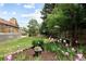Picturesque backyard showcasing lush greenery, vibrant flowers, and well-maintained landscaping for a serene outdoor experience at 10572 E Orchard Pl, Englewood, CO 80111