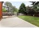 Backyard featuring a large lawn, patio with chairs, trees and fenced perimeter at 10572 E Orchard Pl, Englewood, CO 80111
