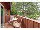 Private balcony featuring outdoor seating, serene views of lush greenery, and a peaceful setting at 10572 E Orchard Pl, Englewood, CO 80111