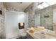 Unique bathroom with comic strip wallpaper, walk-in shower, and updated vanity at 10572 E Orchard Pl, Englewood, CO 80111