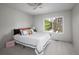 Cozy bedroom featuring a window, ceiling fan, and carpeted floors at 10572 E Orchard Pl, Englewood, CO 80111