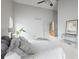 Bright bedroom featuring vaulted ceilings, a ceiling fan, and a calming neutral color palette at 10572 E Orchard Pl, Englewood, CO 80111
