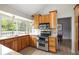 Bright kitchen featuring wood cabinets, granite countertops, and stainless-steel appliances at 10572 E Orchard Pl, Englewood, CO 80111