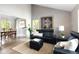Open living room with hardwood floors and views into the dining room at 10572 E Orchard Pl, Englewood, CO 80111