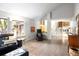 Spacious living room with large windows, hardwood floors, and staircase at 10572 E Orchard Pl, Englewood, CO 80111