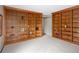 Spacious room featuring wall-to-wall bookshelves, providing ample storage and display space at 10572 E Orchard Pl, Englewood, CO 80111