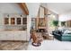 Living room with fireplace and wet bar at 10572 E Orchard Pl, Englewood, CO 80111