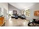 Bright living room featuring large windows, hardwood floors, and vaulted ceiling at 10572 E Orchard Pl, Englewood, CO 80111