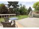 Outdoor patio with seating, lawn, trees and fenced perimeter at 10572 E Orchard Pl, Englewood, CO 80111