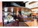 Elegant bar area with a curved counter and seating at 14393 E Marina Dr, Aurora, CO 80014