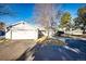 Gray ranch style home with attached garage at 14393 E Marina Dr, Aurora, CO 80014