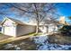 Gray exterior home with attached garage and small front yard at 14393 E Marina Dr, Aurora, CO 80014