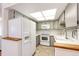 White appliances and light gray cabinets in kitchen at 14393 E Marina Dr, Aurora, CO 80014