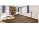 Living area with a stone fireplace and carpeted floor at 14393 E Marina Dr, Aurora, CO 80014
