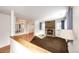 Living room with hardwood and carpeted floors, stone fireplace at 14393 E Marina Dr, Aurora, CO 80014