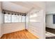 Sunroom features hardwood floors and built-in shelving at 14393 E Marina Dr, Aurora, CO 80014