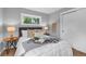 Cozy bedroom featuring natural light, hardwood floors, and a comfortably styled queen-size bed at 2735 S Dahlia St, Denver, CO 80222