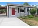 Charming single-story home with a red front door and a freshly poured concrete driveway at 2735 S Dahlia St, Denver, CO 80222