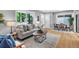 Open-concept kitchen and living room with neutral colors, stainless appliances and lots of light at 2735 S Dahlia St, Denver, CO 80222