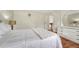 Comfortable Primary bedroom with hardwood floors, a white queen-sized bed and neutral décor at 19140 E Milan Cir, Aurora, CO 80013
