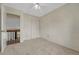 Bright bedroom with neutral walls and carpet has a closet and view to the landing at 19140 E Milan Cir, Aurora, CO 80013