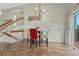 View of dining area with stairs and hardwood floor at 19140 E Milan Cir, Aurora, CO 80013