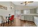 Bright dining area features wood floors, vaulted ceilings, and access to the outdoor deck through sliding doors at 19140 E Milan Cir, Aurora, CO 80013