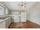 Traditional kitchen featuring wooden floor, ceiling fan, and complete appliances set at 19140 E Milan Cir, Aurora, CO 80013