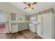 Bright kitchen with updated cabinets, stainless steel appliances, and hardwood floors at 19140 E Milan Cir, Aurora, CO 80013