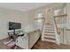 Cozy living room with hardwood floors, a staircase, and comfortable furniture at 19140 E Milan Cir, Aurora, CO 80013