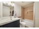 Bathroom featuring a shower-tub combination, modern sink, and vanity, offering functionality and style at 3482 S Eagle St # 102, Aurora, CO 80014